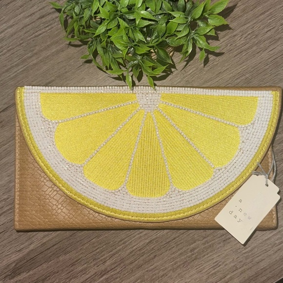 a new day Handbags - a new day Yellow and Tan Clutch